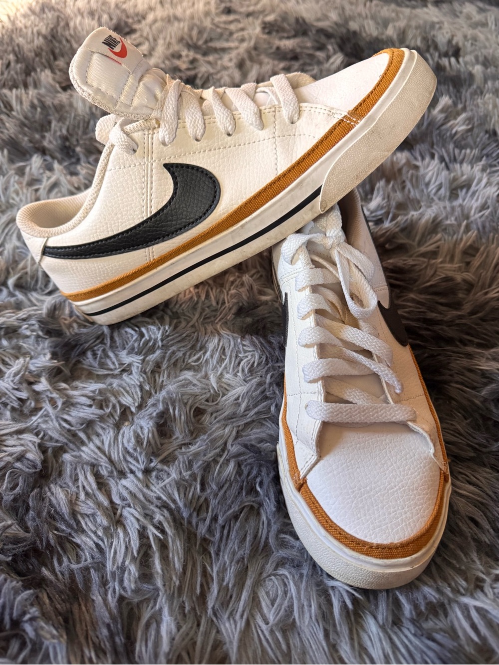 Nike White Low-Top Sneakers with Black Swoosh and Brown Trim